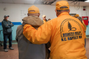 Members of the disaster recovery team listen for instructions