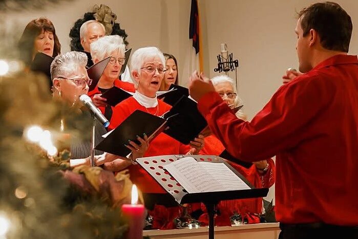 Traditional choir director Kolton Black leading the Christmas cantata