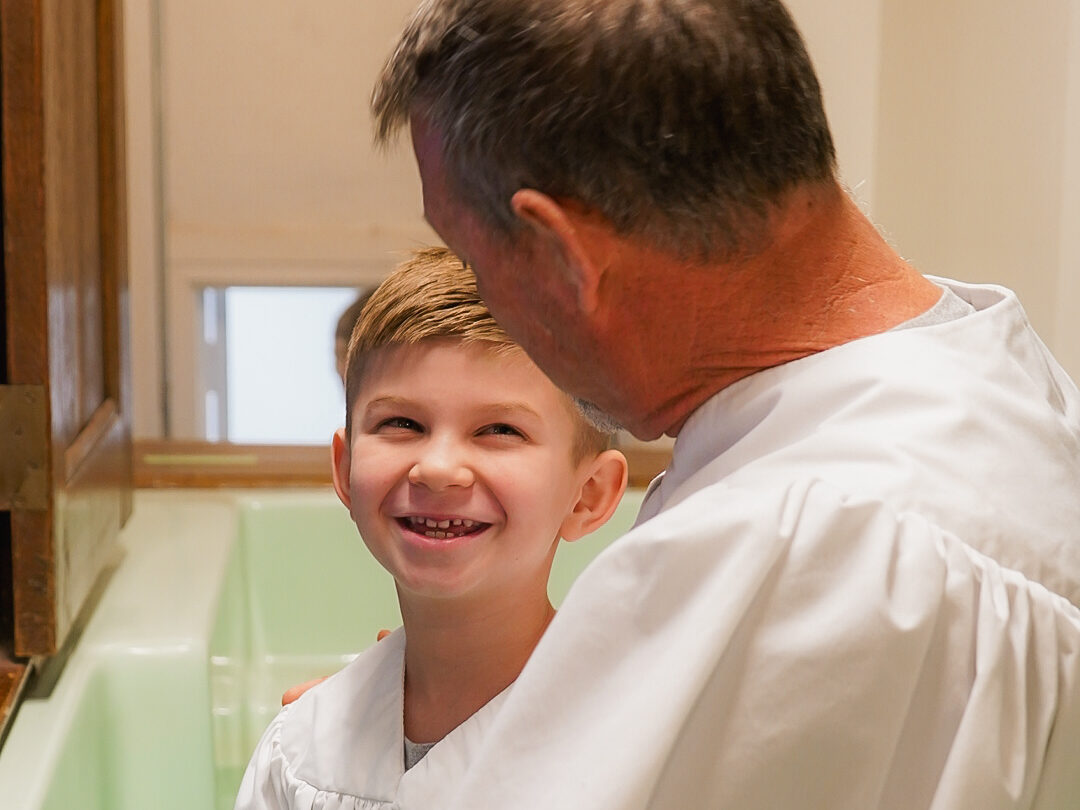 Pastor Sammy leading baptism on Sunday morning